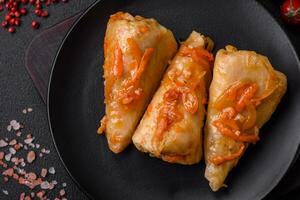 Delicious cabbage rolls with meat, rice, salt, spices and herbs photo