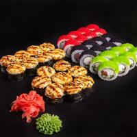Sushi set with ginger and wasabi on a slate plate photo