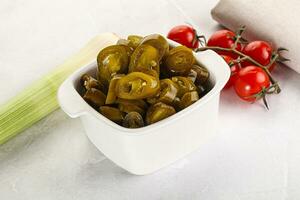 Sliced canned jalapeno pepper photo