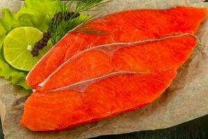 Salted salmon over wooden background photo