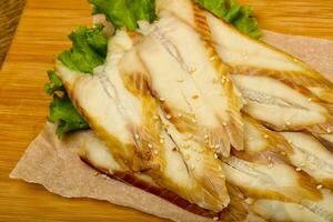 Eel sashimi over wooden background photo