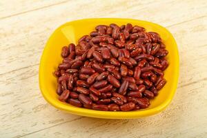 Dry beans over wooden background photo