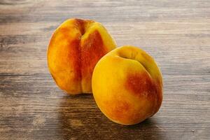 Two Sweet ripe tasty peaches photo