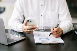 Businessman working with smart phone and laptop and digital tablet computer in office with digital marketing media in virtual icon photo