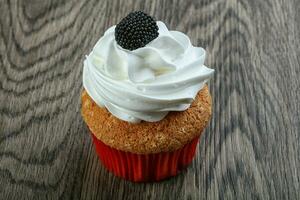 Cupcake over wooden background photo