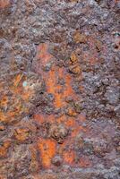 rusty metal surface with orange paint photo