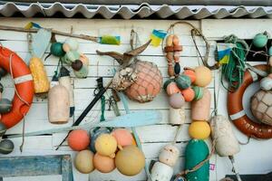 a wall with many different types of buoys photo