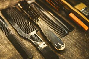 A set of combs for a haircut lie on a shelf in the salon photo