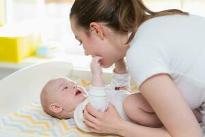 Mother and baby play and have fun at home. Really happy family photo