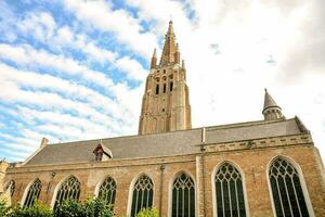 a church with a tall spire photo