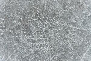 traces on the ice from skates on the rink photo