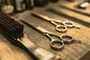 professional scissors and combs lie on a shelf in a hairdresser photo