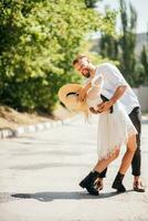 Very happy couple laughing outdoors in summer on a sunny day photo