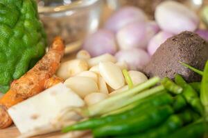 Garlics are among orange galangal, shrimp paste, Thai chilli, shallots, bergamot and much more ingredients. photo
