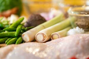 Lemongrass is placed between Thai chilli,salt and also having the background of food ingredients seasoning. photo