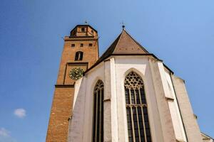 a church with a tower and a steeple photo