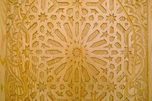 a carved wooden door with intricate designs photo