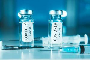 COVID-19 coronavirus vaccine. Ampoule and syringe close-up. Concept photo