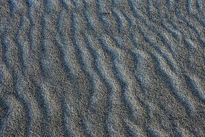 sand with a wavy pattern photo