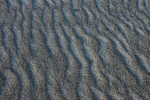 sand with a wavy pattern photo
