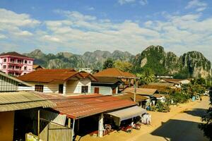 a village with mountains in the background photo