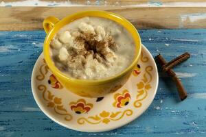 cup of canjica, typical food consumed in the Brazilian Festa Juninas photo