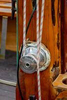 a close up of a rope and a lock on a boat photo