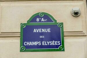 a sign on a building that reads avenue de champs elysees photo