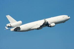 Nordic Global Airlines McDonnell Douglas MD-11 OH-LGC cargo plane departure and take off at Hong Kong Chek Lap Kok Airport photo