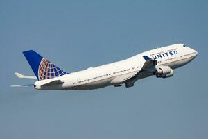 United Airlines Boeing 747-400 N120UA passenger plane departure and take off at Hong Kong Chek Lap Kok Airport photo