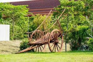 a wooden cart on the grass photo