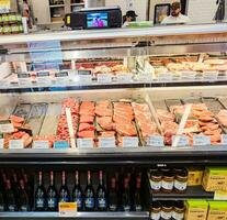 Portland, Oregon, USA - 11.06.2023 Fresh meat in a supermarket refrigerated display case New Seasons. photo