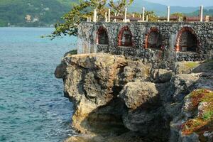 Ancient Fort on Rocky Cliff Shore photo