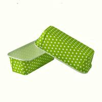 Green paper baking forms for cakes with dotted pattern photo