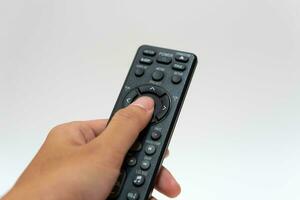 Hand holding television and audio remote control isolate on white background with clipping path photo