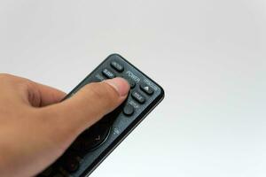 Hand holding television and audio remote control isolate on white background with clipping path photo