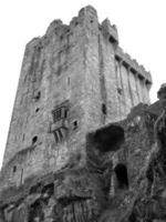 Old celtic castle tower isolated over white background, Blarney castle in Ireland, celtic fortress photo