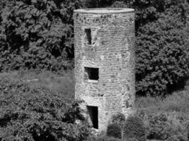 Old celtic castle tower among the trees, Blarney castle in Ireland, old ancient celtic fortress photo