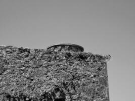 Ancient tower wall background, Blarney castle in Ireland, celtic fortress photo