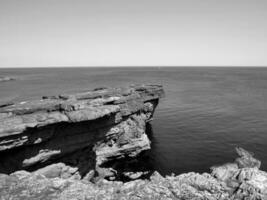 Cliffs and Atlantic ocean, rocks canyon and laguna, beauty in nature. Vacation travel background photo