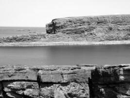 Cliffs and Atlantic ocean, clouds, rocks and laguna, beauty in nature. Vacation trip relaxation background photo