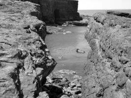 Cliffs and Atlantic ocean, rocks canyon and laguna, beauty in nature. Vacation travel background photo