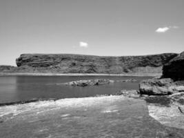 Cliffs and Atlantic ocean, clouds, rocks and laguna, beauty in nature. Vacation trip relaxation background photo