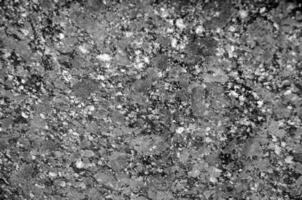 Granite texture close view, natural pattern black and white background photo