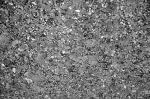 Granite texture close view, natural pattern black and white background photo