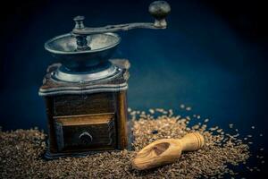 a pile of flaxseeds Linum usitatissimum on olive wood photo