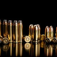 Bullet isolated on black background with reflexion. Cartridges for rifle and carbine on a black. Rifle bullets close-up on black back. photo