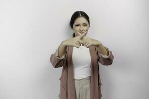 Beautiful Asian woman employee wearing cardigan with hand gesture pose rejection or prohibition with copy space photo