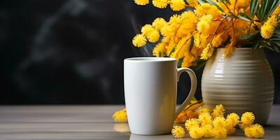 Vase with mimosa and cup of tea, spring bouquet with copy space, card for International Women's Day photo