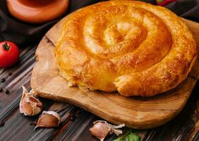 Whole homemade baked traditional Greek cheese pie photo